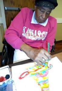 Yvonne Sanders watercolors during an Art Therapy session.