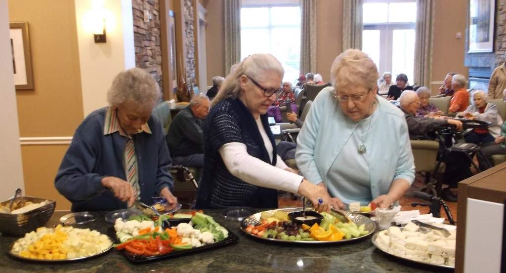 Residents enjoy refreshments during Art is Ageless.