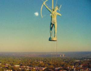A photo of the Kansa Indian statue installation atop the Kansas Capital dome.