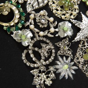 Jewelry Art - Detail of tree made out of vintage brooches