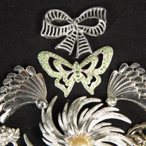 Jewelry Art - Detail of tree made out of vintage brooches