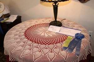 Pat Tieben, “Round Table Topper,” first place in Fiber Arts, amateur.