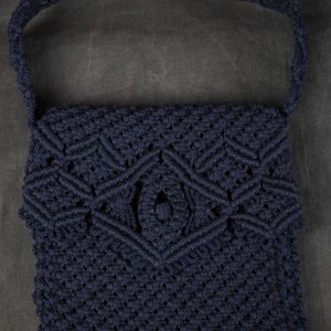 Fiber Arts - Macrame Bag - Navy blue macrame bag with handle and closure flap with decorative detail at edge of flap.