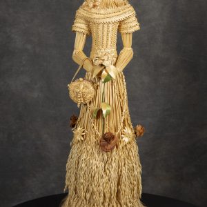 Fiber Arts - Our Victorian Lady of Kansas - Victorian female woven out of wheat with intricate design of bodice on dress. Curled hair and hat woven out of wheat with female holding purse woven out of wheat.