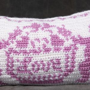 Fiber Arts - Valentine Remembered - pillow with crochet cover featuring two cherubs on each side holding a sign that says Love.