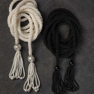 Mixed Media Crafts - Black and White Crochet Beads - individual black cord and a white cord croched out of beads with a beaded tassel at both ends.