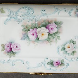 Mixed Media Crafts - Box with Baby Roses and Scrolls - Detail - rectangle porcelain box painted with pink and white baby roses and blue/green scrolls. Box is accented with gold metal and gold bow as the closure.