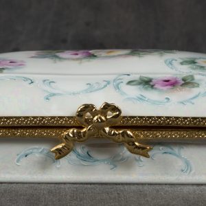 Mixed Media Crafts - Box with Baby Roses and Scrolls - rectangle porcelain box painted with pink and white baby roses and blue/green scrolls. Box is accented with gold metal and gold bow as the closure.