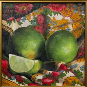 Painting - Limes - painting of two green limes sitting next to a lime slice with all sitting on a colorful red, gold, and green fabric