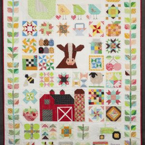 Quilting - Farm Girl - quilt made of a varitey of patterned fabrics made into blocks to make images of a red barn, sunflowers, cow, hen and chicks, sheep and bumble bee. The quilt has a very whimsical theme and was made for a girl.