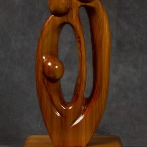 Sculpture 3D - Abstract Family - sculpture of a mother, father and child carved from wood and finished with a shiny laquer. The sculpture is created of simple curvations designs representing each figure with a round head.