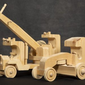 Sculpture 3D - CJs Toy Shop - image of two toys sculpted out of wood. The first toy is a truck with a boom and wrecking ball, the second is a sculpture of a road grader.