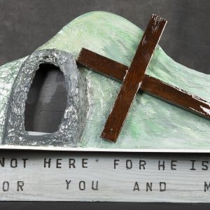 Sculpture 3D - He is Risen - large sculpture of empty tomb of Jesus with wooden cross next to tomb opening with the words 