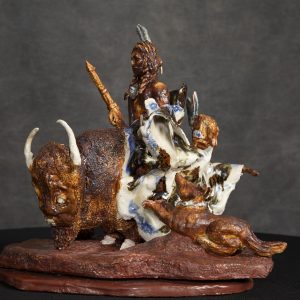 Sculpture 3D - The Journey - sculpture of indian sitting on a large buffalo with a smaller boy riding along wrapped in a blue and white blanket with a dog beside them.