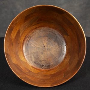 Sculpture 3D - Walnut and Maple Bowl - Detail - bowl sculpted out of walnut wood with three thin pieces of maple through the center of the bowl from edge to edge.