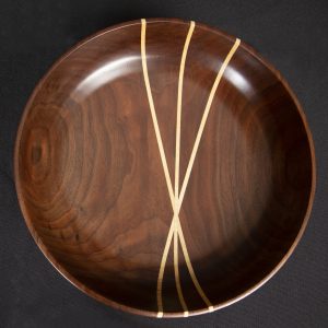 Sculpture 3D - Walnut and Maple Bowl - bowl sculpted out of walnut wood with three thin pieces of maple through the center of the bowl from edge to edge.